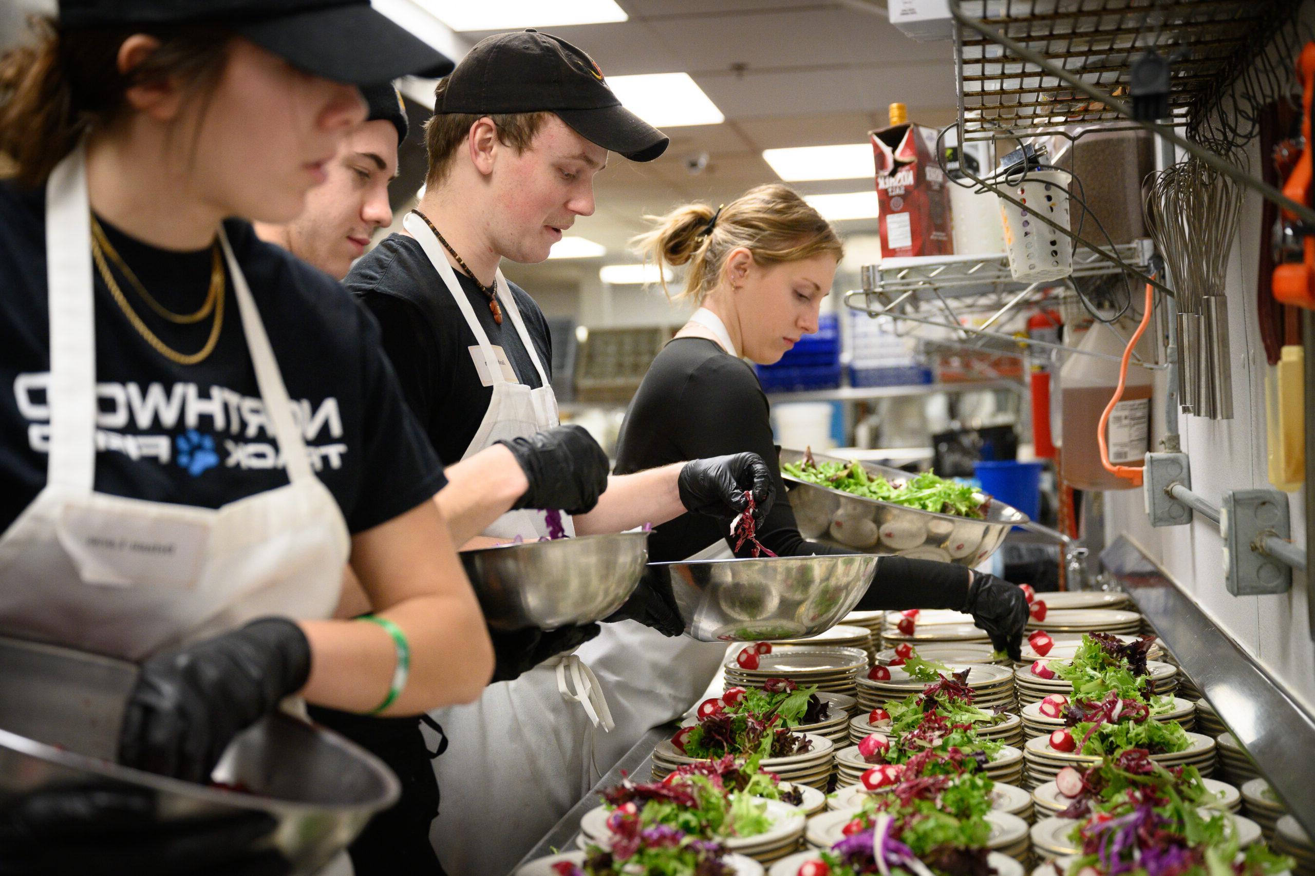 Students prepping food for the Stafford Dinner